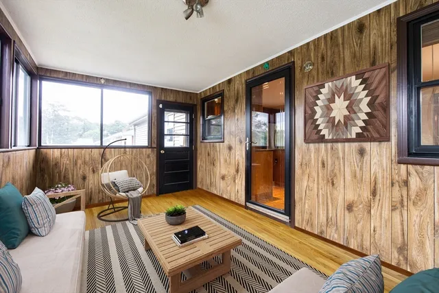 a bedroom with a bed and a refrigerator