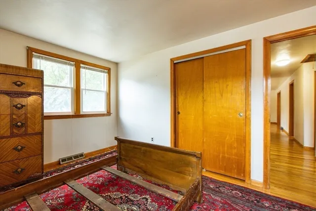 a bathroom with a toilet and a shower curtain