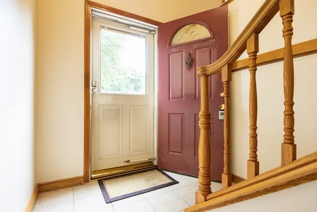 a view of a livingroom with wooden floor and a fireplace