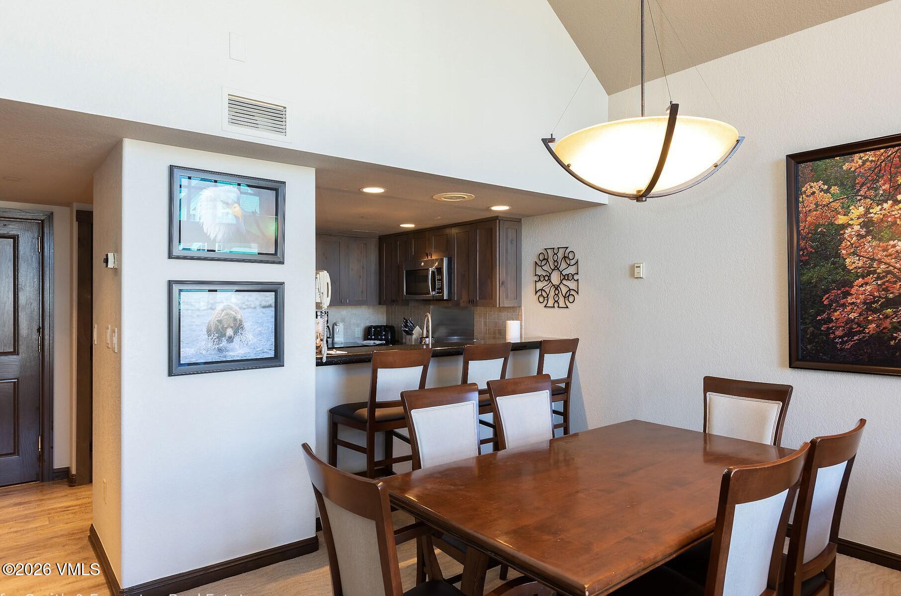 210 Offerson Road, Unit 41249 Beaver Creek, CO 81620 - Photo 4 of 25 a view of a dining room with furniture