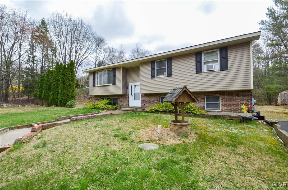 253 Sundance Road Effort, PA 18330 - Photo 1 of 25 a house view with a garden space