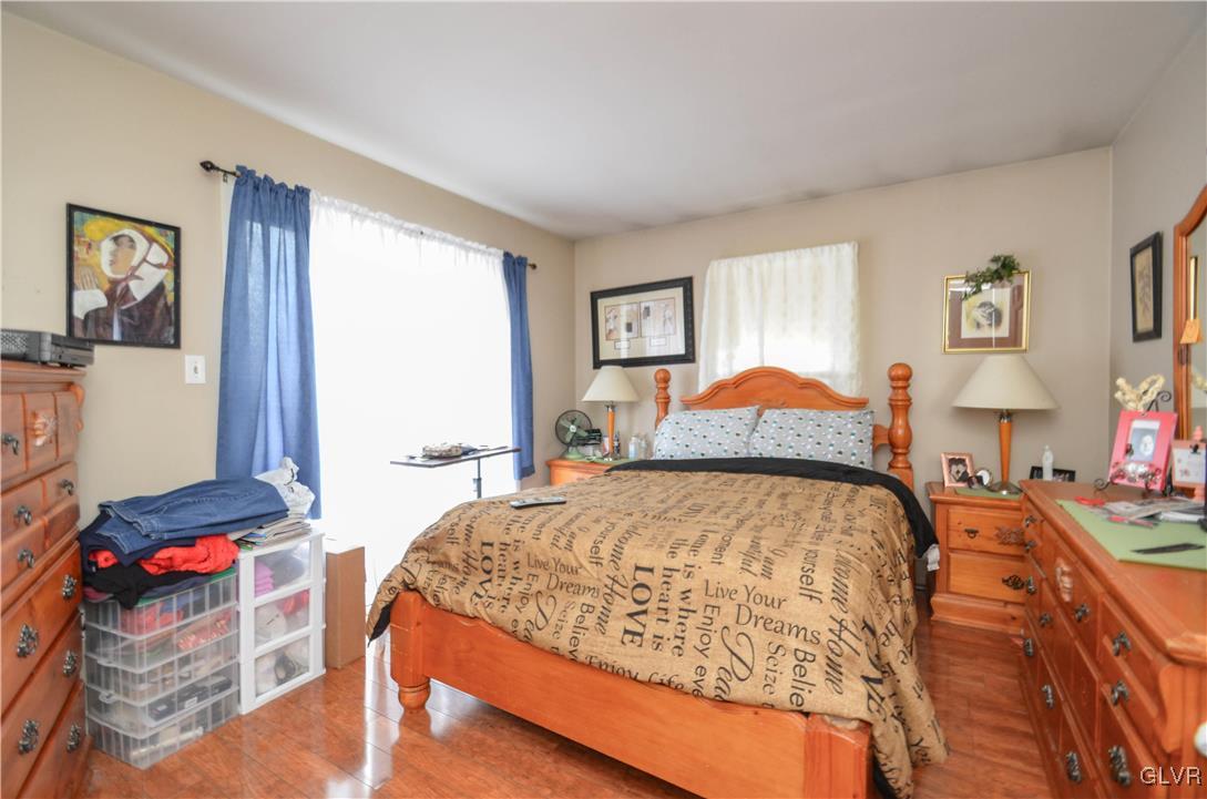 253 Sundance Road Effort, PA 18330 - Photo 15 of 25 a bed sitting in a bedroom next to a window