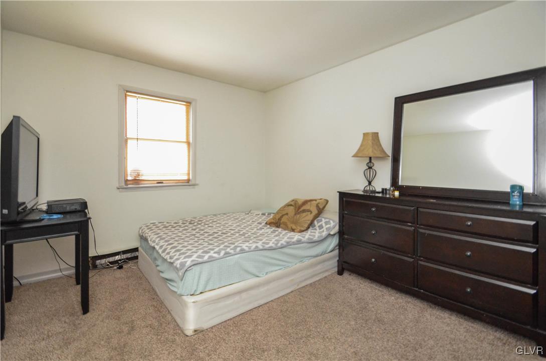 253 Sundance Road Effort, PA 18330 - Photo 16 of 25 a bedroom with a bed and a flat screen tv