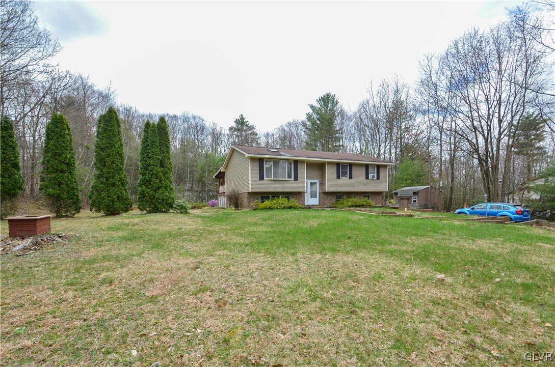 253 Sundance Road Effort, PA 18330 - Photo 24 of 25 a view of a house with backyard and sitting area