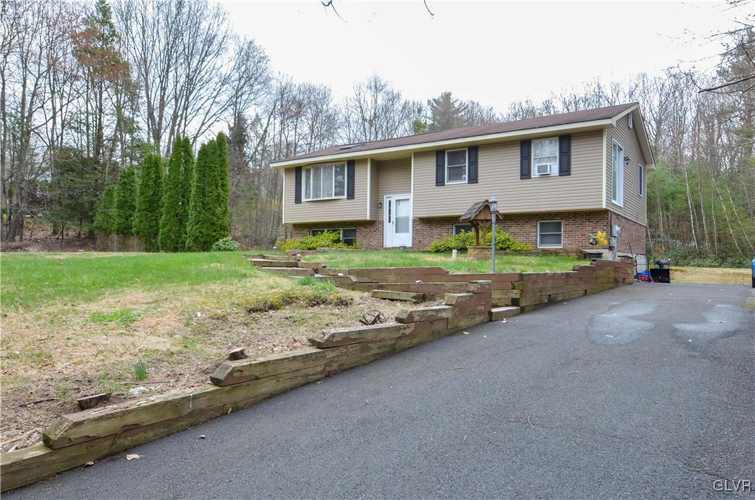 253 Sundance Road Effort, PA 18330 - Photo 25 of 25 a view of a house with a yard and large tree