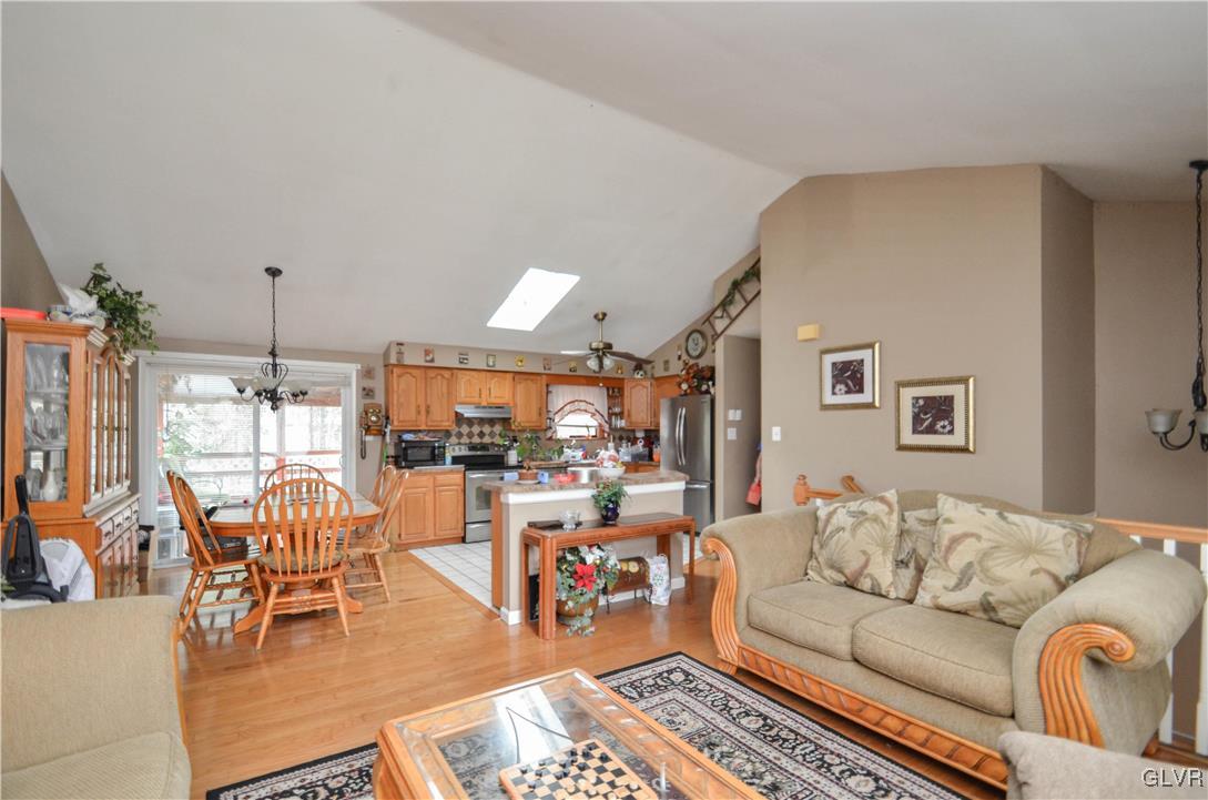 253 Sundance Road Effort, PA 18330 - Photo 3 of 25 a living room with furniture kitchen view and a chandelier