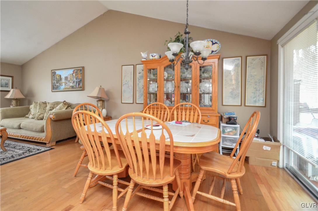 253 Sundance Road Effort, PA 18330 - Photo 5 of 25 a dining room with furniture a chandelier and wooden floor