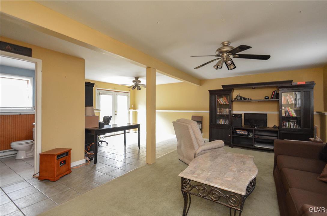 253 Sundance Road Effort, PA 18330 - Photo 10 of 25 a living room with furniture and a flat screen tv