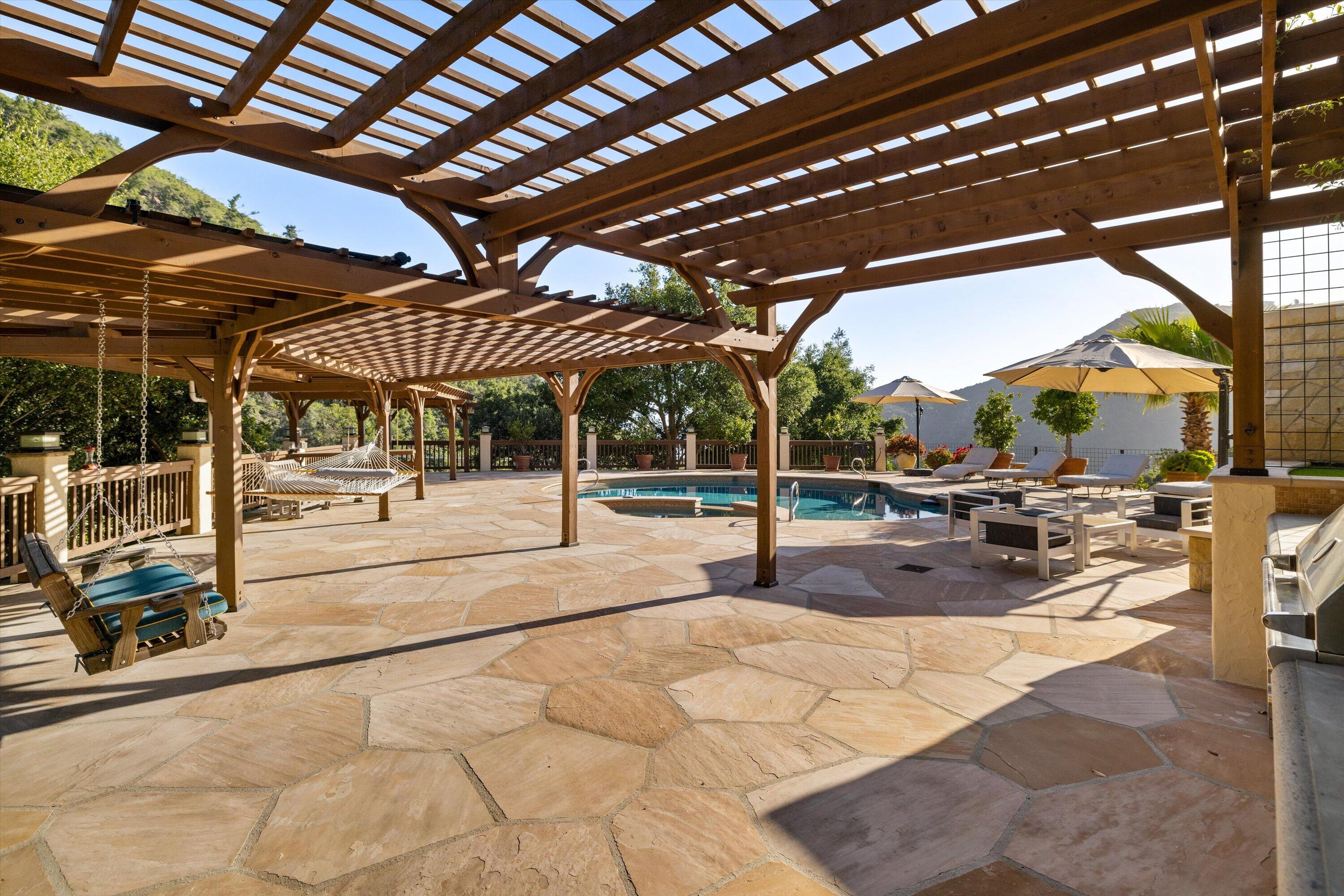 1090 Toro Canyon Road Santa Barbara, CA 93108 - Photo 11 of 59 a view of a swimming pool with a patio