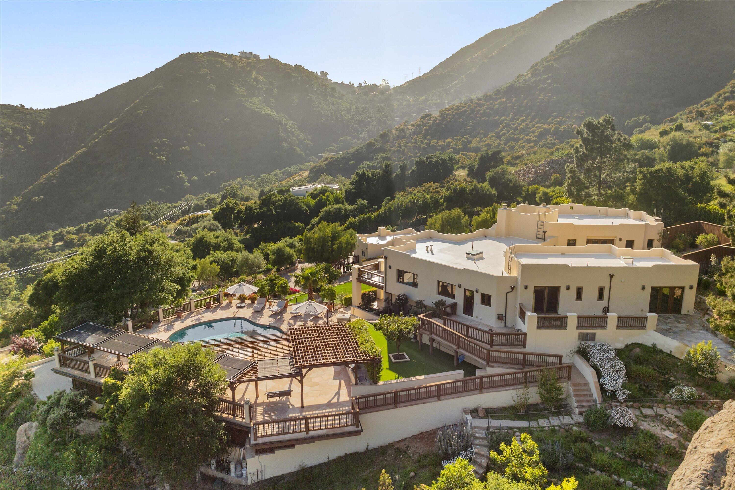 1090 Toro Canyon Road Santa Barbara, CA 93108 - Photo 4 of 59 an aerial view of a house with a yard