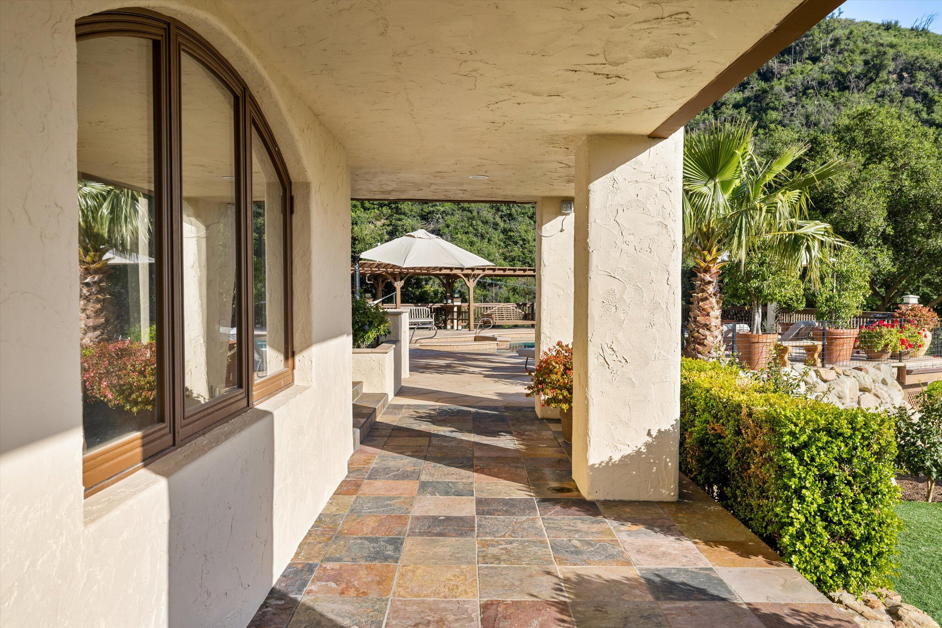 1090 Toro Canyon Road Santa Barbara, CA 93108 - Photo 7 of 59 a porch with seating space and entrance door