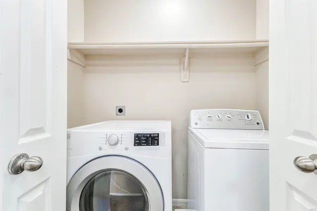 a utility room with dryer and washer