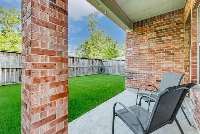 a view of a balcony with chairs