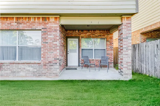 a view of backyard with a table and chair