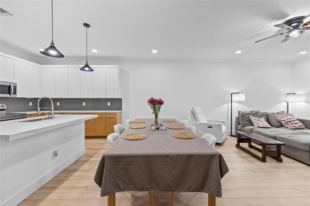 6810 Church Street Jupiter, FL 33458 - Photo 11 of 39 a large kitchen with a table and chairs