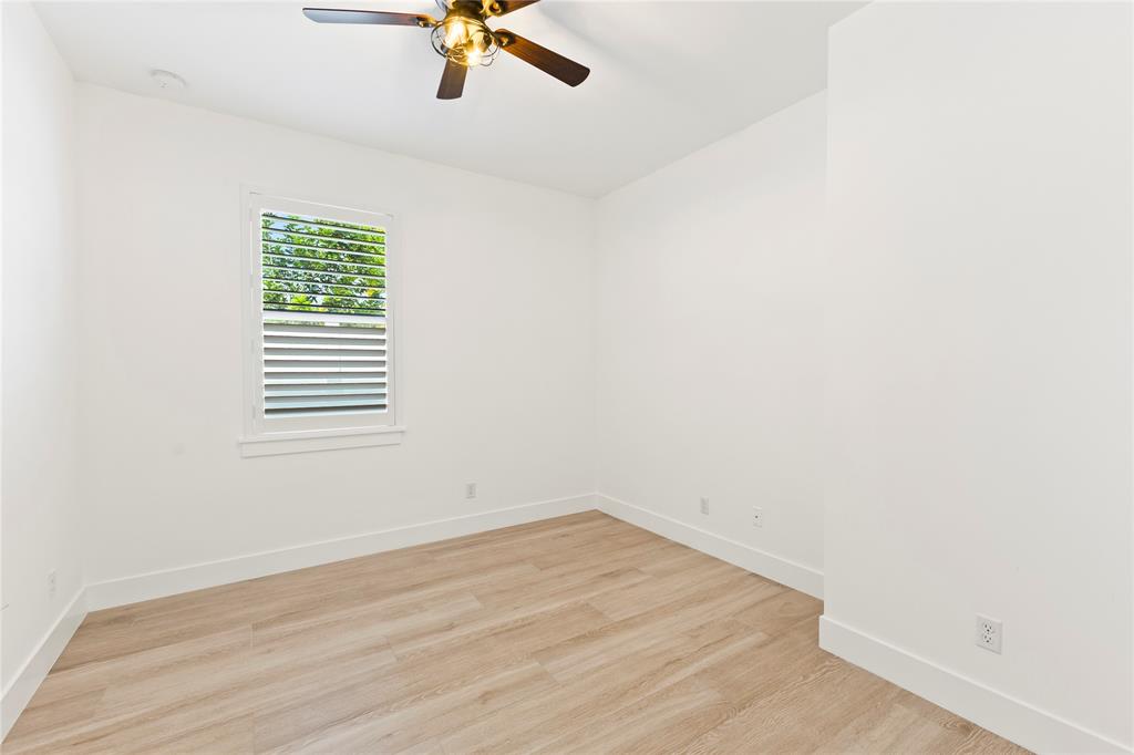 6810 Church Street Jupiter, FL 33458 - Photo 22 of 39 a view of a room with a window and wooden floor