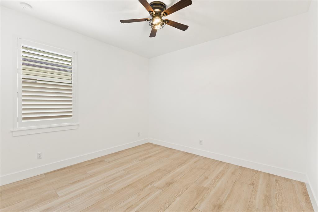 6810 Church Street Jupiter, FL 33458 - Photo 25 of 39 an empty room with a window and a fan