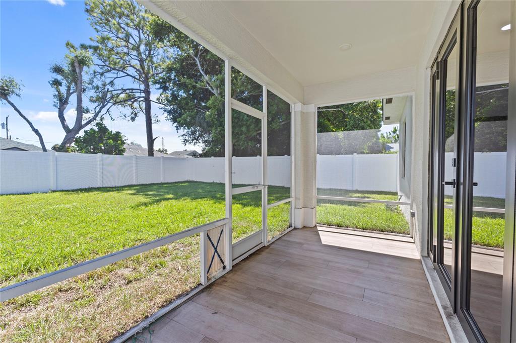 6810 Church Street Jupiter, FL 33458 - Photo 28 of 39 a view of an entryway with a garden