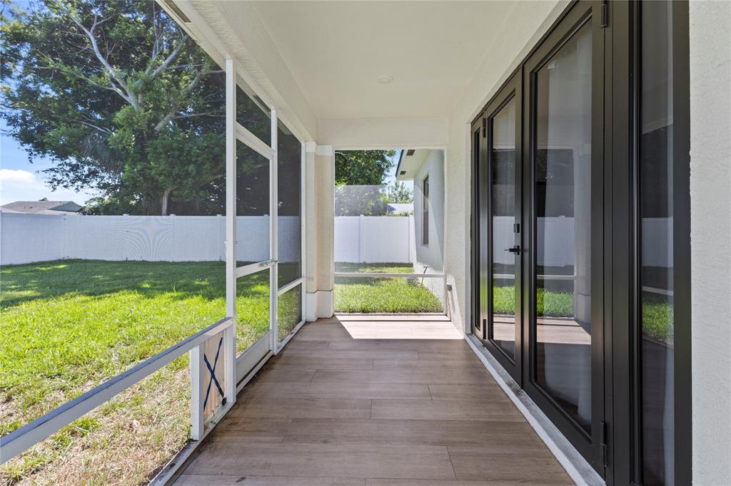 6810 Church Street Jupiter, FL 33458 - Photo 29 of 39 a view of an entryway with garden