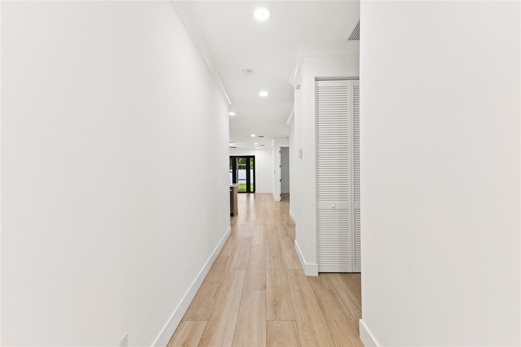 6810 Church Street Jupiter, FL 33458 - Photo 3 of 39 a view of a hallway with wooden floor