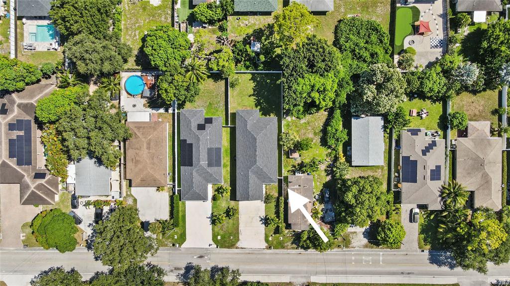 6810 Church Street Jupiter, FL 33458 - Photo 35 of 39 a street sign on a small garden