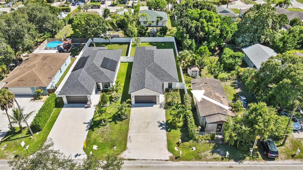 6810 Church Street Jupiter, FL 33458 - Photo 38 of 39 an aerial view of multiple houses with yard