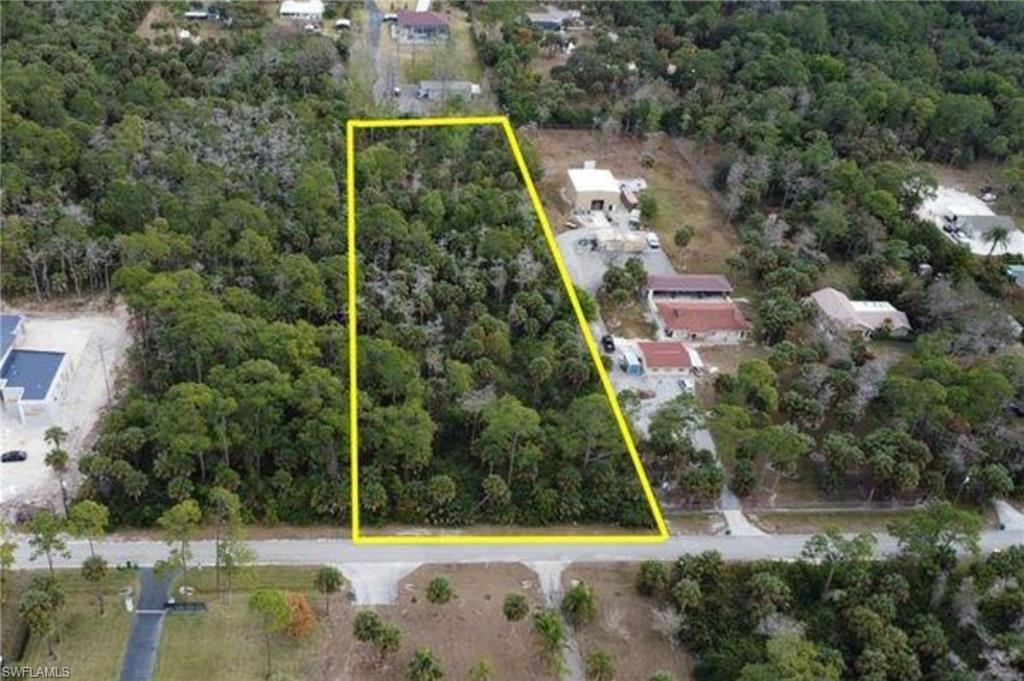 9th Street Southwest Naples, FL 34117 - Photo 1 of 1 a view of a yard with potted plants