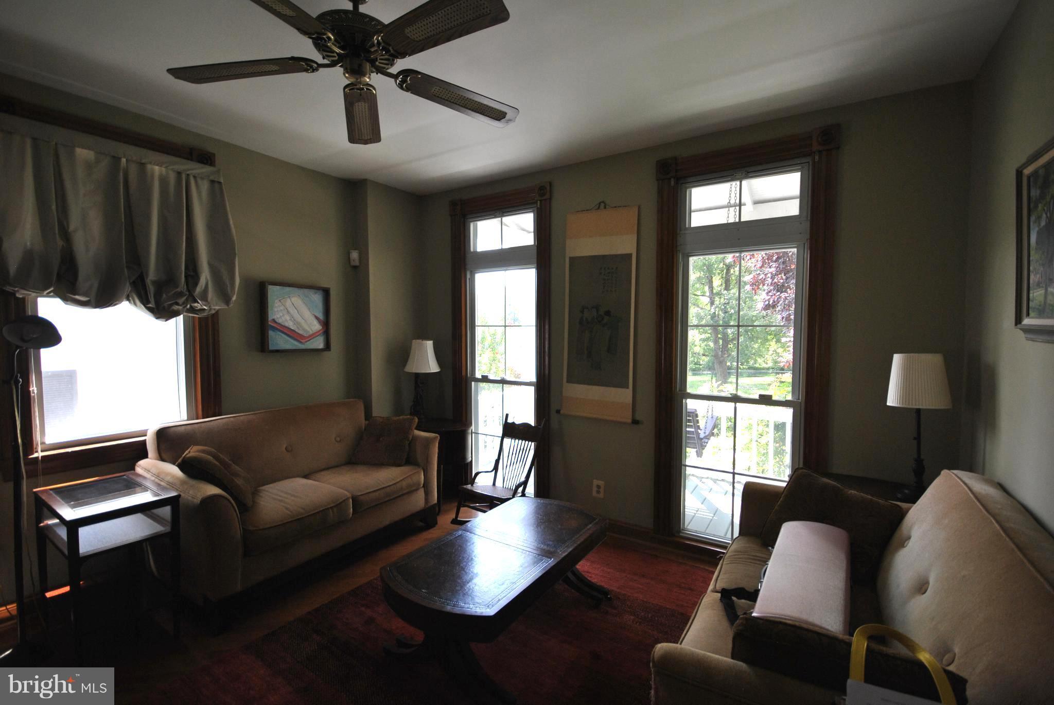 5939 Falls Road Baltimore, MD 21209 - Photo 3 of 20 a living room with furniture and a large window