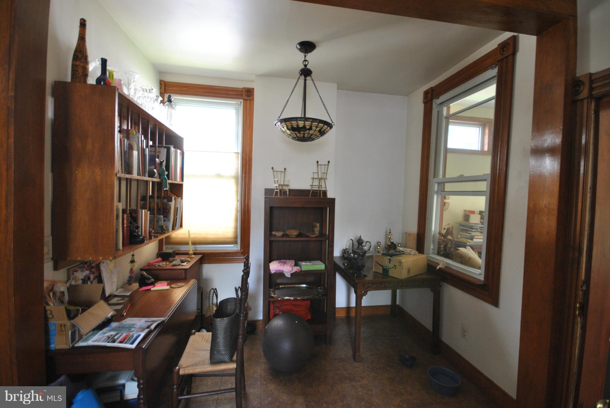 5939 Falls Road Baltimore, MD 21209 - Photo 8 of 20 a very nice looking room with many windows and furniture