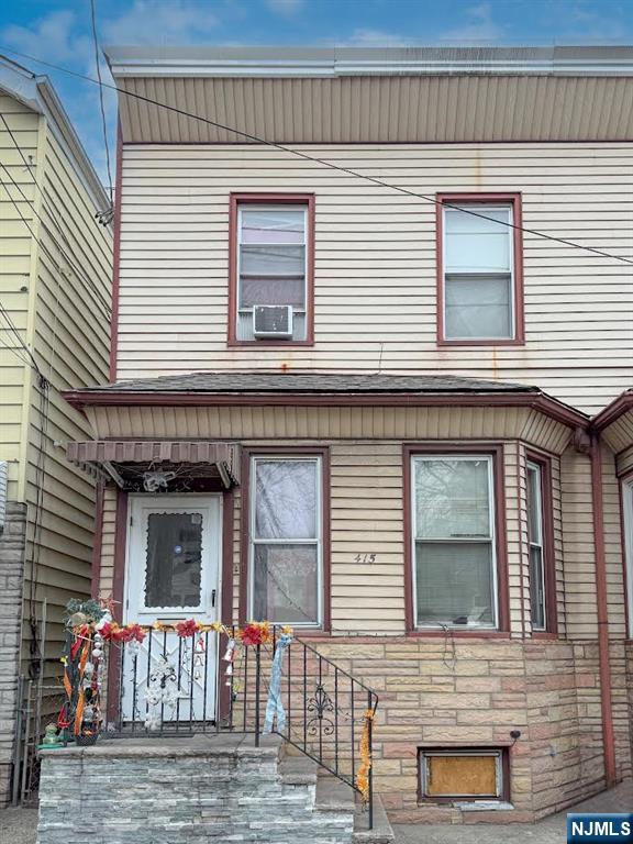 415 Lafayette Street Newark, NJ 07105 - Photo 1 of 2 a front view of a house with a garage