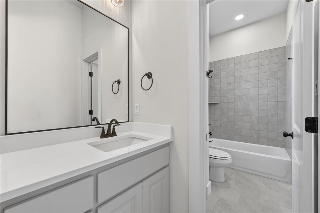 517 Longhorn Lane Springtown, TX 76082 - Photo 31 of 39 Bathroom featuring vanity, washtub / shower combination, and recessed lighting