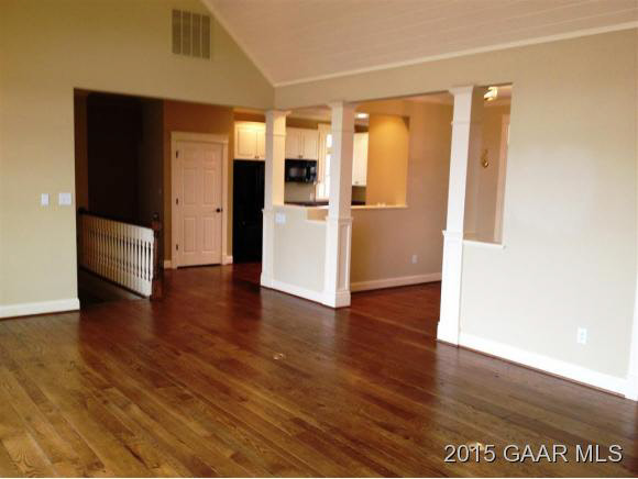 579 Shirey Road Swoope, VA 24479 - Photo 13 of 36 a view of a kitchen with wooden floor and refrigerator