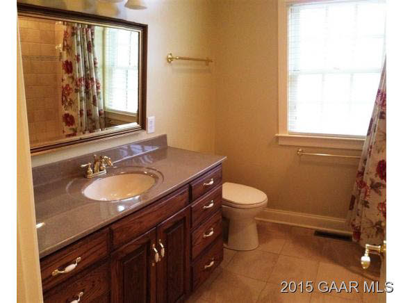 579 Shirey Road Swoope, VA 24479 - Photo 14 of 36 a bathroom with a granite countertop sink toilet and mirror