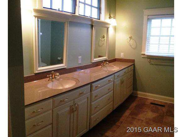 579 Shirey Road Swoope, VA 24479 - Photo 21 of 36 a bathroom with a granite countertop sink and a mirror