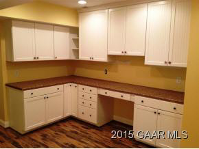 579 Shirey Road Swoope, VA 24479 - Photo 27 of 36 a kitchen with granite countertop white cabinets and a sink