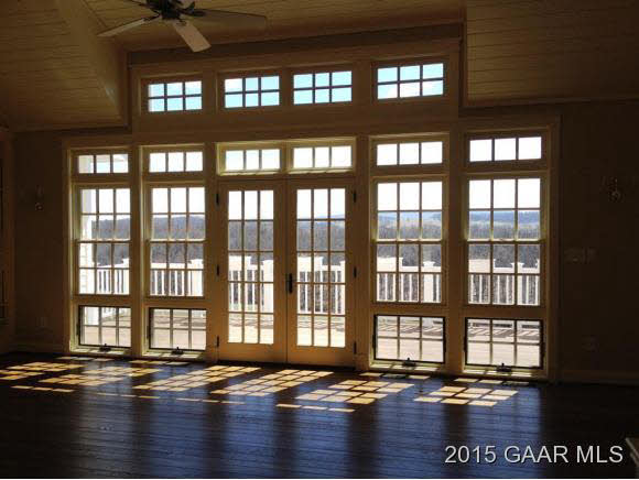 579 Shirey Road Swoope, VA 24479 - Photo 4 of 36 a view of empty room with windows and wooden floor