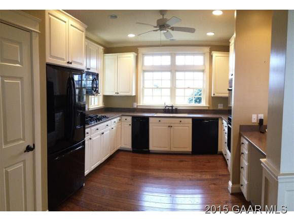 579 Shirey Road Swoope, VA 24479 - Photo 5 of 36 a kitchen with a sink a refrigerator and cabinets