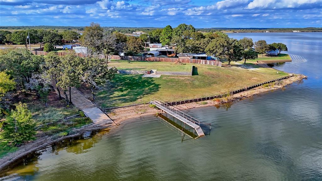 a view of a lake with a yard