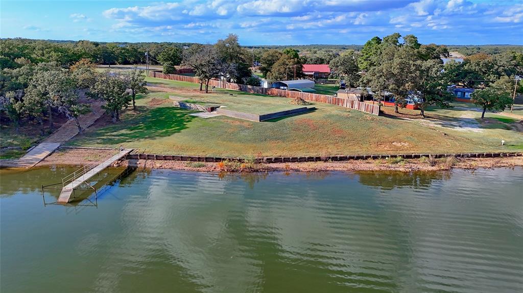 1 Tradewinds Nocona, TX 76255 - Photo 20 of 37 an aerial view of a house with a yard and lake view