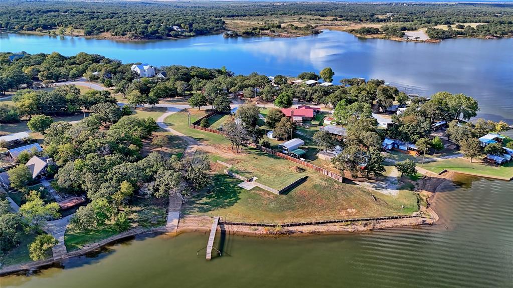 1 Tradewinds Nocona, TX 76255 - Photo 31 of 37 an aerial view of a house with a swimming pool yard and outdoor seating