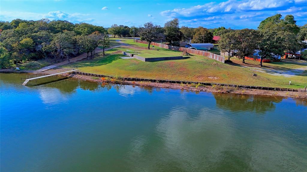 1 Tradewinds Nocona, TX 76255 - Photo 8 of 37 a view of a swimming pool with an ocean view