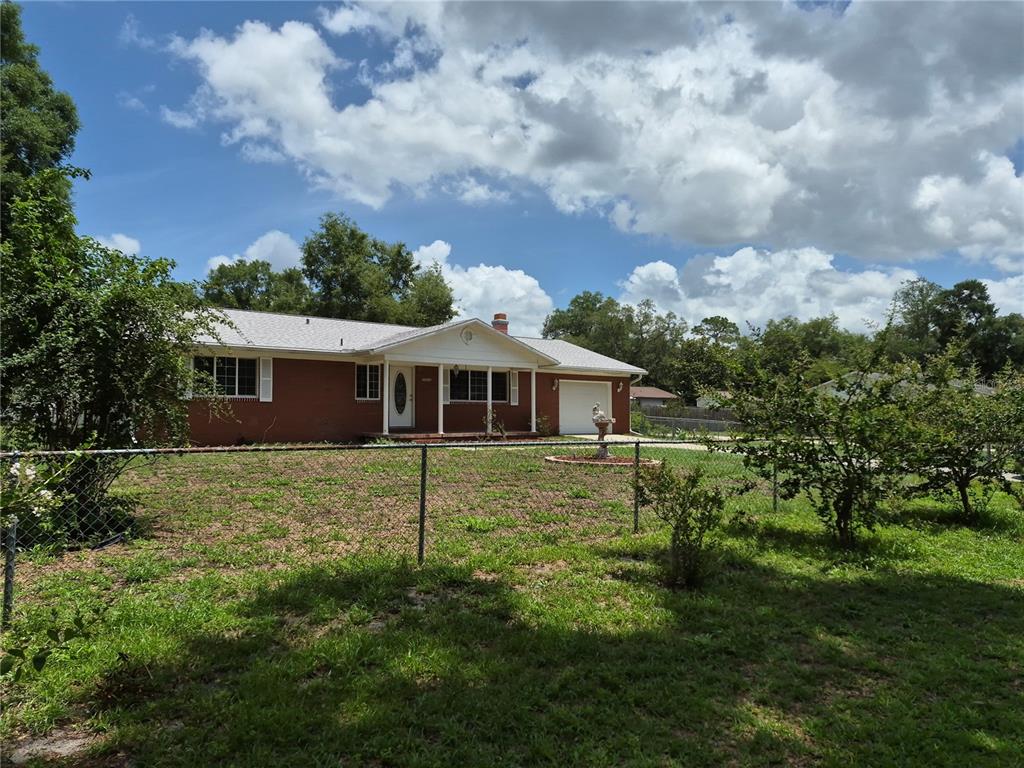 25632 Southwest 19 Avenue Newberry, FL 32669 - Photo 17 of 20 a view of a house with a yard