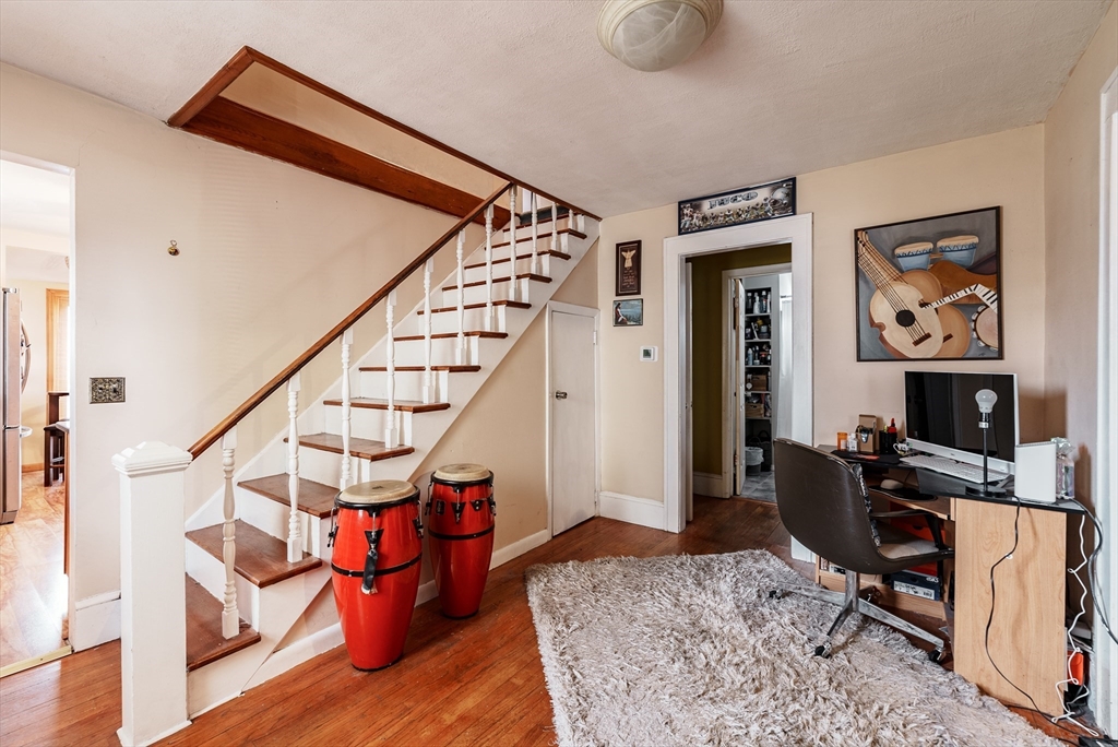 170 Eddy Street Springfield, MA 01104 - Photo 12 of 25 a workspace with wooden floor and furniture