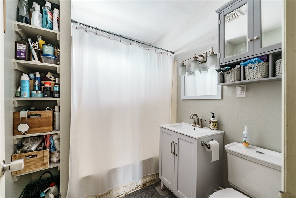 170 Eddy Street Springfield, MA 01104 - Photo 14 of 25 a bathroom with a sink toilet and a shower