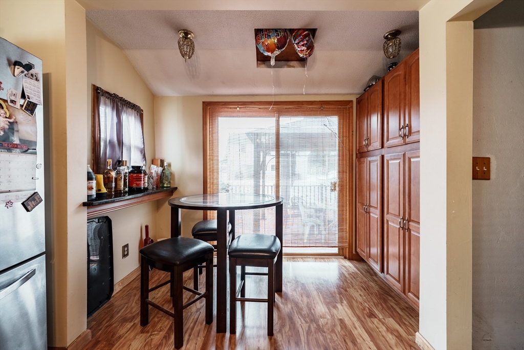 170 Eddy Street Springfield, MA 01104 - Photo 6 of 25 a view of a dining room with furniture window and wooden floor