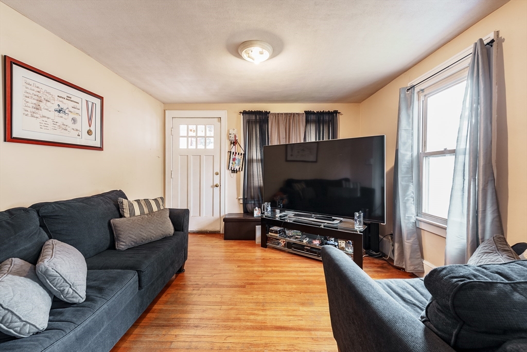 170 Eddy Street Springfield, MA 01104 - Photo 7 of 25 a living room with furniture and a flat screen tv
