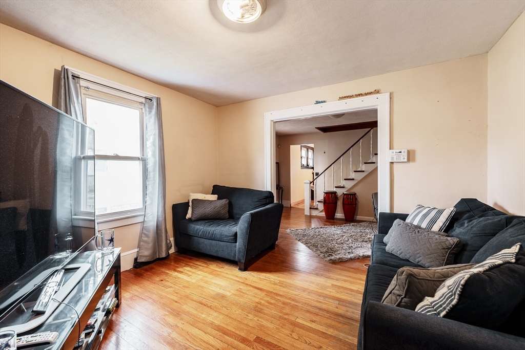 170 Eddy Street Springfield, MA 01104 - Photo 9 of 25 a living room with furniture and a flat screen tv