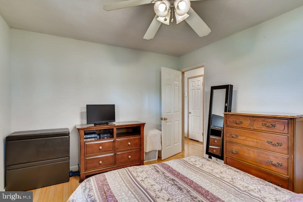 3714 Campfield Road Baltimore, MD 21207 - Photo 17 of 32 a bedroom with a bed and furniture