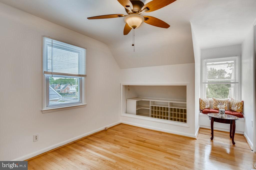 3714 Campfield Road Baltimore, MD 21207 - Photo 24 of 32 a view of an empty room with window and wooden floor