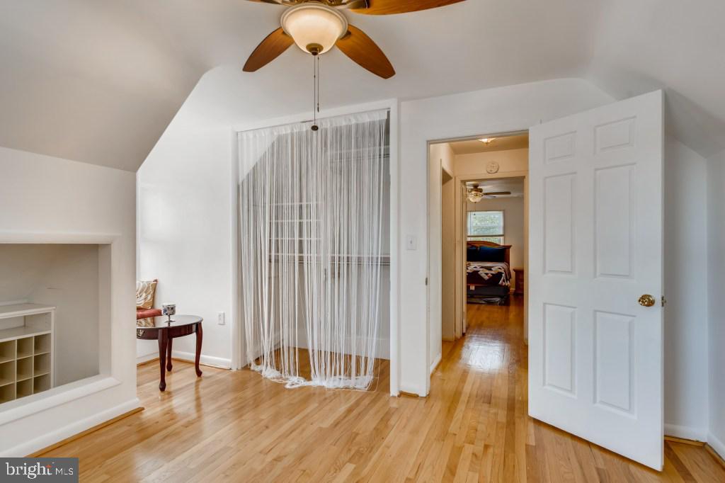 3714 Campfield Road Baltimore, MD 21207 - Photo 25 of 32 a view of a livingroom with wooden floor and a ceiling fan